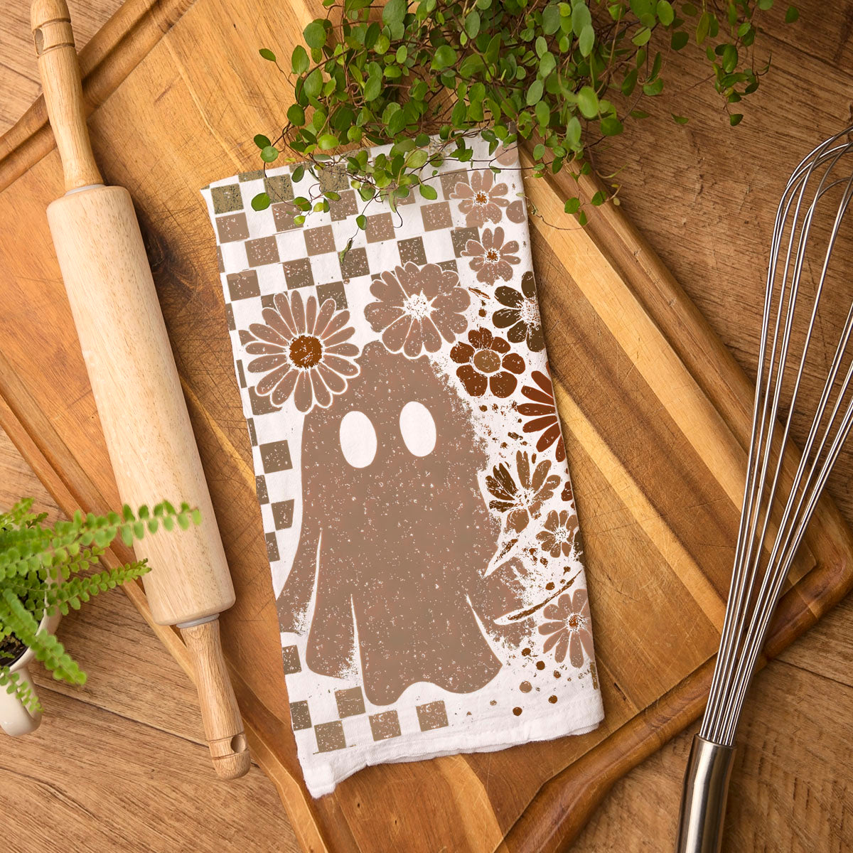 autumn dish towel with skull motif and brown checks
groovy retro halloween towel with daisies and ghost
boho chic skull towel for cozy fall home décor
