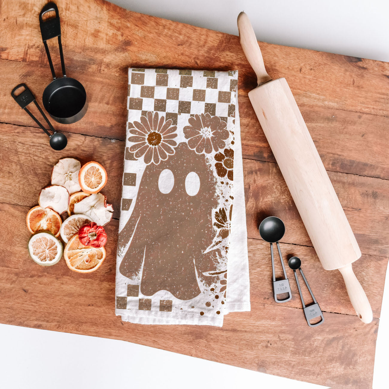 brown checkered skull towel for cabin or lodge kitchen
subtle skull and ghost towel for office halloween décor
neutral skeleton dish towel for small apartment kitchen