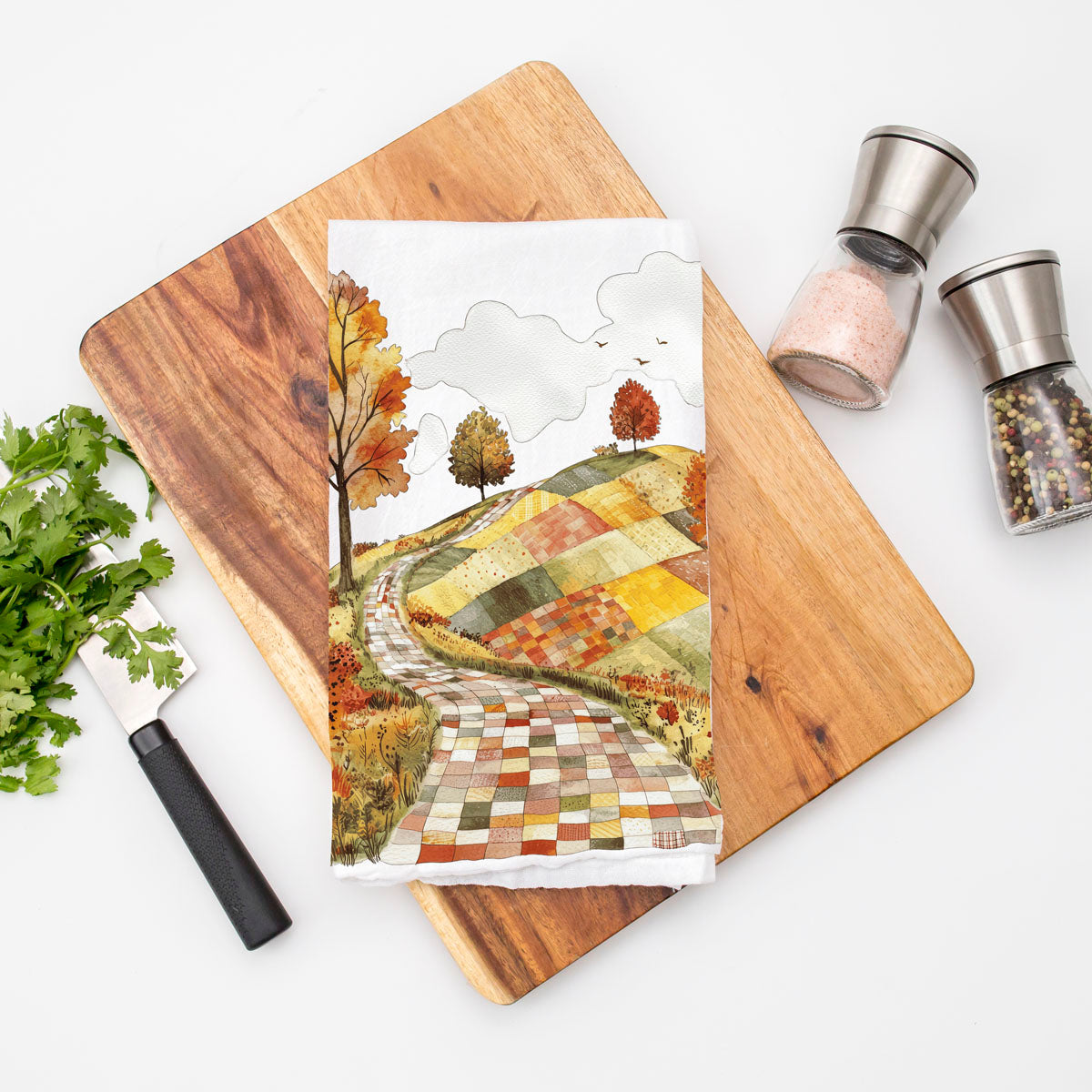 patchwork fall fields kitchen towel with winding lane
fall forest road towel for pumpkin spice coffee bar
harvest landscape dish towel with orange yellow trees
autumn village road style towel for cozy home décor
winding stone path towel for fall cabin kitchen