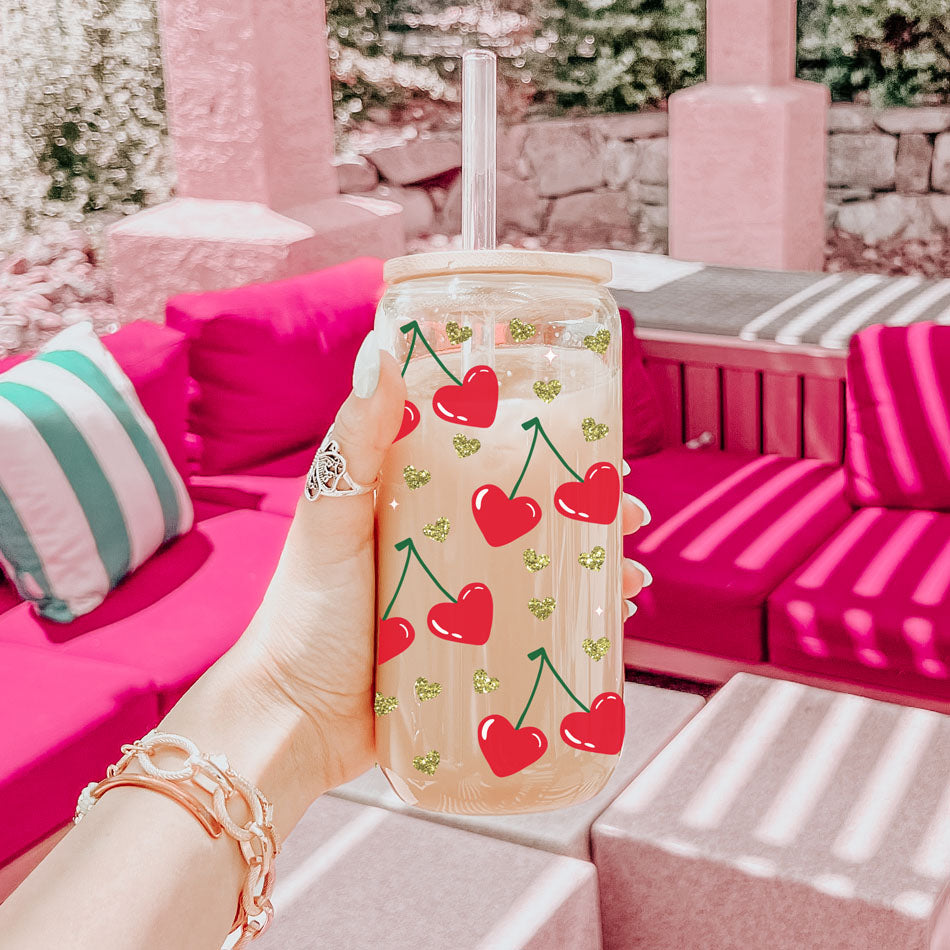 Chic 20oz glass cups with bamboo lid and glass straw, featuring Self Love Club and red heart cherry graphics.
Inspirational 20oz glass cups with bamboo lid and glass straw, perfect for women’s empowerment gifts.