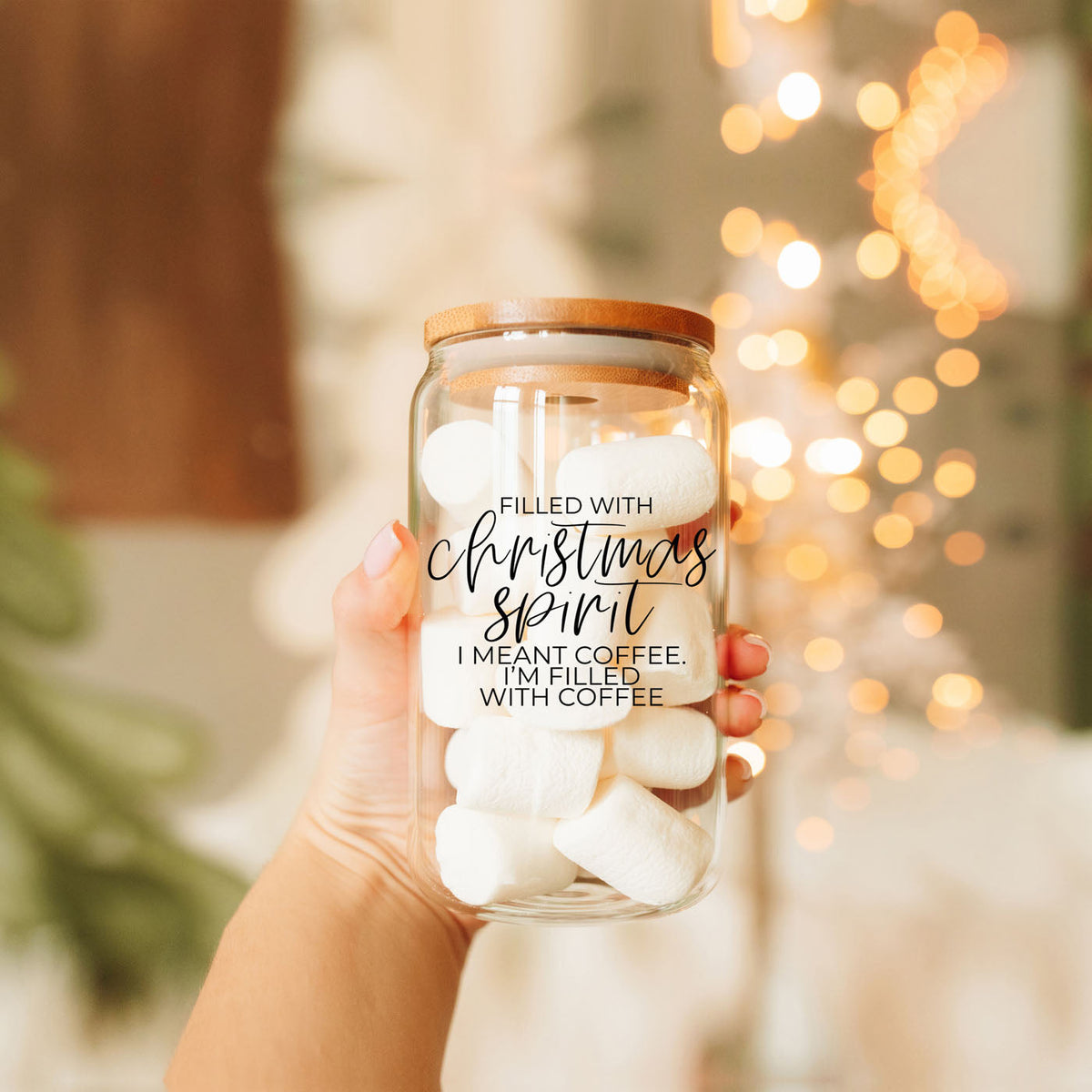 Funny 17oz Christmas glass tumbler with bamboo lid and reusable metal straw featuring “Filled With Christmas Spirit, I Meant Coffee.” A cute holiday iced coffee cup and Christmas gift for coffee lovers, moms, teachers, coworkers and friends.