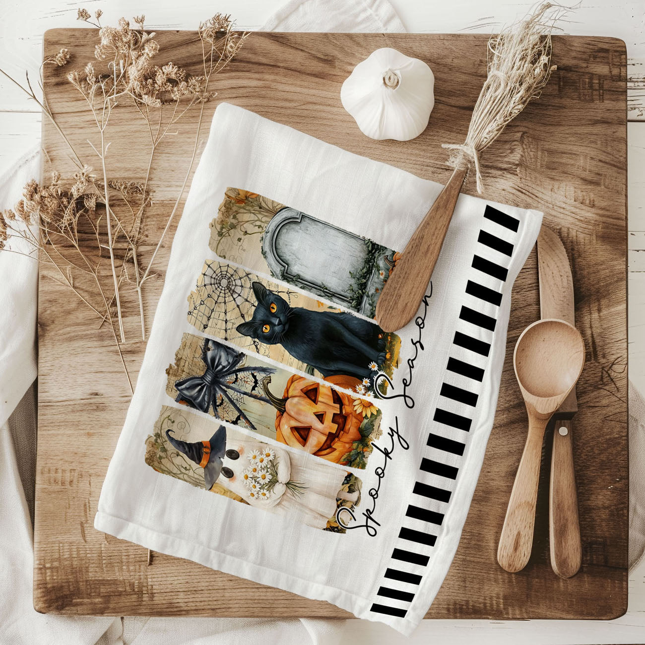 spooky season bar cart towel with jack o lantern
ghost and tombstone halloween towel for gothic kitchen
minimal spooky season towel with striped border
trendy halloween kitchen towel for october baking
