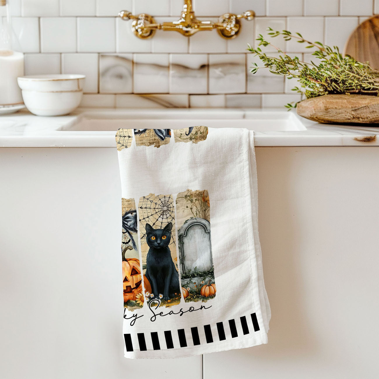 neutral halloween kitchen towel with modern spooky illustrations
ghost pumpkin spiderweb towel hanging on oven handle
stylish halloween tea towel with black cat grave and pumpkins
spooky season bar cart towel with ghost and jack o lantern