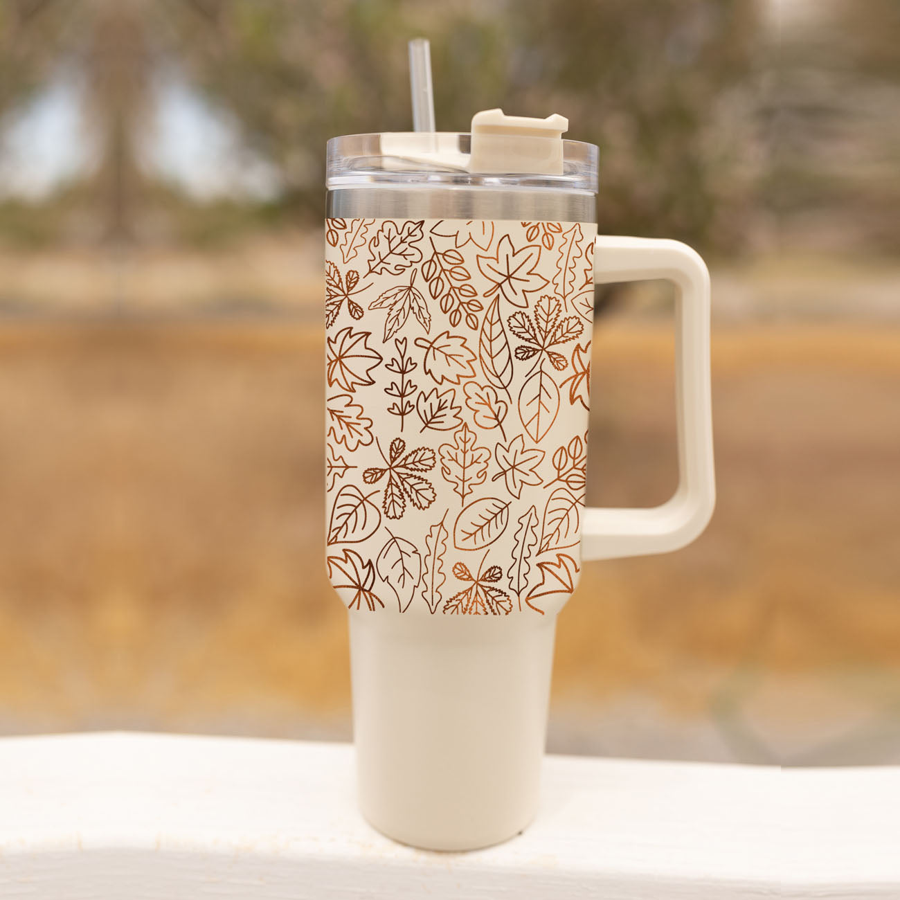 stylish fall tumbler for moms
thanksgiving tumbler cup
cute neutral fall cup
pumpkin spice season cup
cozy season tumbler aesthetic
fall stainless steel tumbler
cream colored autumn tumbler
cute coffee tumbler for fall
fall cup with reusable straw
Insulated autumn water cup with leaf design
Fall travel mug alternative with leaf artwork
Autumn cup with lid straw and leaf print