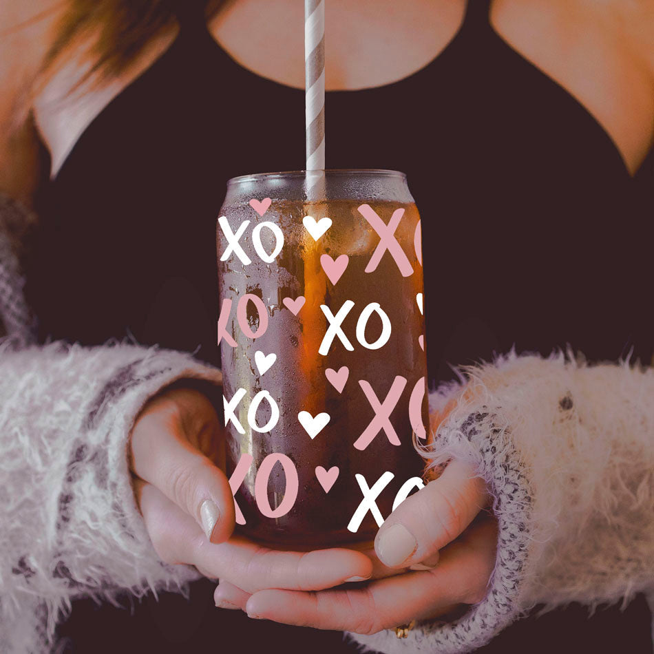 20oz glass cups with bamboo lid and glass straw featuring pink and white XO’s and hearts for a fun Valentine’s gift.
Cute 20oz glass cups with bamboo lid and glass straw, featuring pink and white XO’s and heart designs for Valentine’s Day.