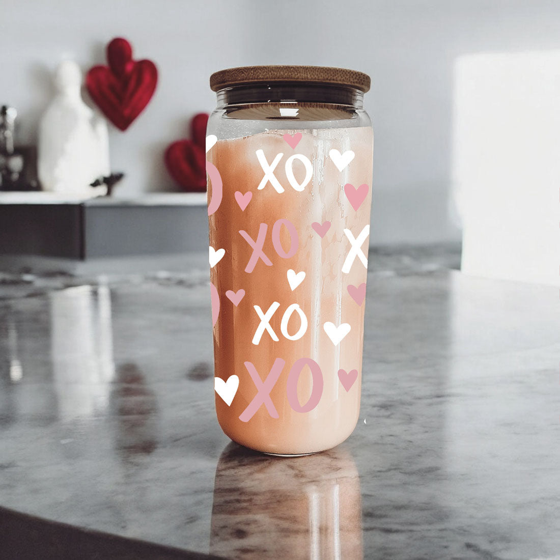 Sweet and modern 20oz glass cups with bamboo lid and glass straw, featuring pink XO’s and hearts for a Valentine’s Day surprise.
20oz glass cups with bamboo lid and glass straw, featuring pink and white XO’s and hearts, a perfect gift for someone special.